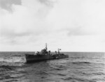 Japanese destroyer Hatsuzakura off Tokyo Bay with a whaleboat from USS Nicholas alongside to transfer Japanese translators and harbor pilots to Nicholas, 27 Aug 1945. Photo 2 of 2.