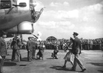 Princess Elizabeth of the United Kingdom christening the B-17G Fortress ‘Rose of York’ by breaking a bottle of English cider against the nose at RAF Thurleigh, Bedfordshire, England, 6 Jul 1944.