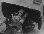 Wrecked Mikazuki being inspected by USMC personnel, off Cape Gloucester, New Britain, 8 Feb 1944; note 4.7-inch gun on the after deckhouse without breechblock