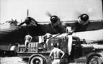 German Air Force mechanics with a Me 323 Gigant heavy transport in the background, near Pisa, Italy, 1943