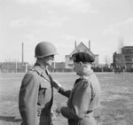 British Field Marshal Bernard Montgomery (right) awarding Major General James Gavin (left) of US 82nd Airborne Division the Distinguished Service Order award, Mönchengladbach, Germany, 21 Mar 1945