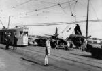 Corsair fighter, under tow, with wings being caught by overhead power lines on Kingsford Smith Drive, Brisbane, Australia, 1945