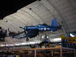 F4U Corsair fighter on display at the Smithsonian Air and Space Museum Udvar-Hazy Center, Chantilly, Virginia, United States, 26 Apr 2009, photo 2 of 2; note P-40E Warhawk fighter in background