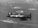 F4U-4B Corsair fighter of US Navy squadron VF-113 in flight over USS Missouri, Inchon, Korea, 2 Oct 1950, photo 1 of 2