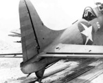 SBD-2 Dauntless aircraft of US Marine Corps squadron VMSB-241 at Midway Atoll, 4 Jun 1942, photo 1 of 2; note damage sustained during attack on Hiryu