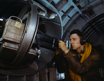 American airmen posing with the side machine gun of a B-17 Flying Fortress bomber, May 1942