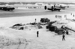 B-24 Liberator and PBY-5A Catalina aircraft at Naval Station Midway, Dec 1942