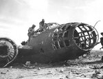 American Marines examined the wreck of a G4M bomber at one of Iwo Jima