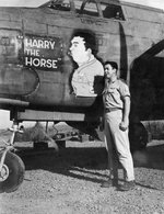 USAAF 3rd Bomb Group airman posing alongside of the nose art of A-20 Havoc aircraft 