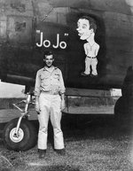 USAAF 3rd Bomb Group airman posing alongside of the nose art of A-20 Havoc aircraft 