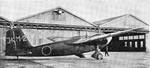 Japanese Navy K7M1 training aircraft by a hangar, Japan, circa 1930s