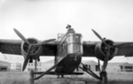 Australian soldier Clive H. Roughley posing with a captured MB.200 bomber, Rayak, Syria-Lebanon, 1941