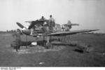 German crew sighting the 20mm cannon on a Bf 109F fighter of JG 54 