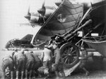 German soldiers loading a 10.5 cm leFH 18 field gun into the cargo bay of a Me 323 Gigant aircraft, circa 1940s