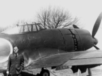 US Navy Ensign Phillip F. Kelly with a captured N1K2-J aircraft, Naval Air Station Willow Grove, Pennsylvania, United States, 1946-1947