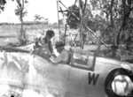 A Royal Air Force pilot explaining the sighting mechanism of a Spitfire fighter to Former Australian Prime Minister Billy Hughes, Darwin, Australia, 1 Nov 1944