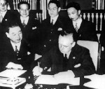 Joachim von Ribbentrop signing the Anti-Comintern Pact, Berlin, Germany, 25 Nov 1936; Japanese ambassador to Berlin Kintomo Mushakoji watching