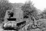 German sIG 33 self-propelled gun (left), DKW NZ350 motorcycle (right), and SdKfz 10 (background), Greece, mid-Apr 1941; 