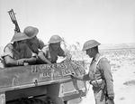 Troops of the Indian 4th Division decorating the side of their truck with 