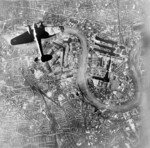 German He 111 bomber in flight northbound over Surrey Docks, London, England, United Kingdom at 1700 hours on 7 Sep 1940, photo 1 of 2