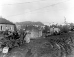 Men of US 7th Armored Division manning a 3-in M5 anti-tank gun at a road near Vielsalm, Belgium, 23 Dec 1944