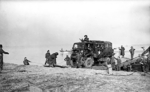 A British Bedford QL truck leaving a raft after crossing the Rhine River near Feldwick,North Rhine-Westphalia, Germany, 24 Mar 1945