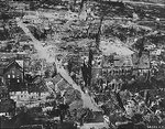 Aerial photograph of a damaged German town during Rhine River area fighting, 24 Mar 1945; taken by crew of B-24 Liberator bomber of 2nd Air Division, US 8th Air Force