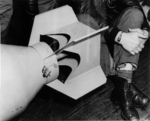 Close-up view of the medal James Doolittle tied to the fins of a 500-pound bomb being readied for the Doolittle Raid, 18 Apr 1942, photo 2 of 2