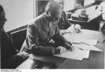 French Minister of Defense General Charles Huntzinger signing the Franco-German armistice document, Compiègne, France, 22 Jun 1940