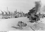 Oil tanks on fire in the port of Calais, France, set aflame by retreating Allied troops, at 1530 hours on 31 May 1940