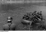 German troops crossing the Meuse River in a rubber raft, near Aiglemont, France, 14 May 1940