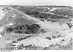 Sand dunes on the beaches near Calais, France, 31 May 1940; note grave of a soldier to the right