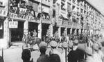 Takashi Sakai and Masaichi Niimi leading Japanese troops on a march on Queen