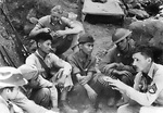 A platoon sergeant of the US 4th Marine Regiment instructs Filipino cadets in the use of a Lewis machine gun, Philippine Islands, circa 1941