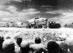 Aboard two Mitsubishi G4M ‘Betty’ bombers in surrender markings, a Japanese delegation stopped at Ie Jima, Ryukyu Islands en route Manila, Philippines for a surrender briefing, 19 Aug 1945. Photo 12 of 12.