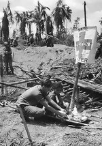 A Filipino woman being treated at an US Navy first aid station, Leyte, Philippine Islands, 20 Oct 1944