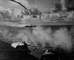 Flaming Japanese Nakajima J1N1 Gekkō "Irving" plunging toward the sea near the Marianas Islands as seen from escort carrier Kitkun Bay, 18 Jun 1944, photo 1 of 2.