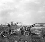 25-pdrs guns of 430th Battery of the British 55th Field Regiment supporting British Guards Armoured Division in the bridgehead over the Meuse-Escaut Canal, Hechtel, Belgium, 16 Sep 1944, photo 2 of 2