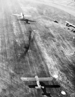 C-47 Dakota aircraft taking off, towing a CG-4A glider, Britain, 17 Sep 1944