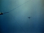 Japanese aircraft in flight over Sand Island, Midway Atoll, 4 Jun 1942