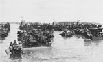 American transports unloading supplies at Morotai, Sep 1944, photo 1 of 2