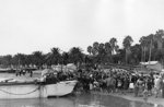 Residents of Arzeu, Algeria greeting American troops on the beach, 8 Nov 1942