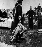 Chinese self-organized burial team taking care of the remains of a slain child, Nanjing, China, Jan 1938