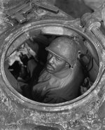 M4 Sherman tank machine gunner US Army Corporal Carlton Chapman in his tank near Nancy, France, 5 Nov 1944