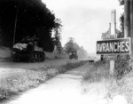 American M5A1 Stuart light tanks moving through Avranches, Mache, Basse-Normandie, France, mid- to late-1944