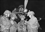 Four stick commanders of 22nd Independent Parachute Company, UK 6th Airborne Division synchronizing watches in front of an Armstrong Whitworth Albemarle aircarft of No. 38 Group RAF, RAF Harwell, Oxfordshire, England, United Kingdom, 5 Jun 1944 at about 2300 hours