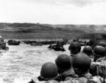 American troops watched activity ashore on Omaha Beach as their LCVP landing craft approached the shore, Normandy, France, 6 Jun 1944, photo 2 of 2