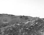 Shell damage to a German concrete 37mm gun emplacement on Utah Beach, Normandy; photo taken 15 Sep 1944