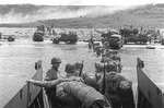 American troops waded ashore from a LCVP landing craft, Omaha Beach, Normandy, 6 Jun 1944