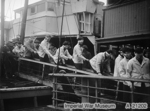 Survivors of sunken German battleship Scharnhorst disembarking a British warship at Scapa Flow, Scotland, United Kingdom, 2 Jan 1944